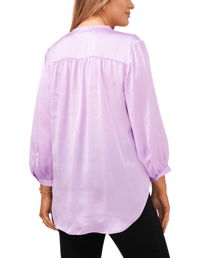 Back of a model wearing a size 1X Aurora V-Neck Blouse in SOFT IRIS by Vince Camuto. | dia_product_style_image_id:261043